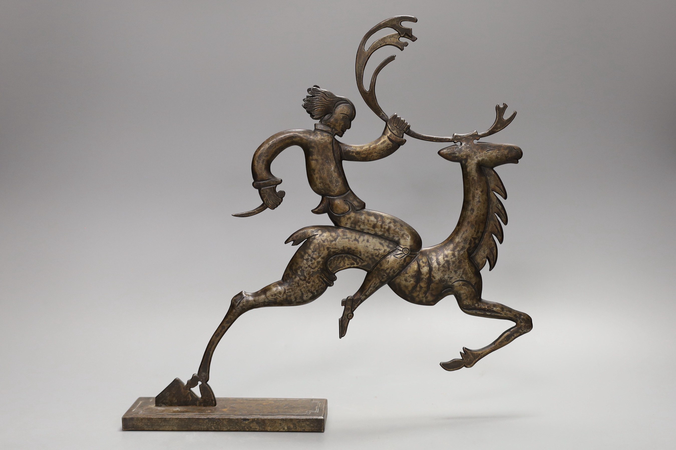 A stylised bronze figure and a metal figure of a dancer, tallest 31cm